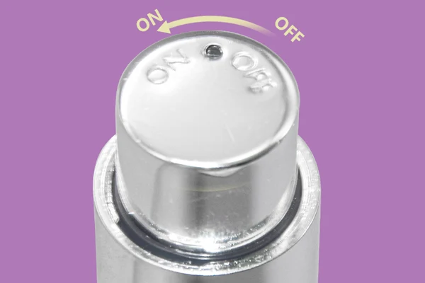 on and off button of airless eye cream bottle